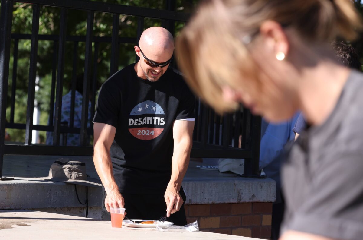 Stuart Ripplinger, supporter of Republican presidential primary candidate Ron DeSantis, eats pancakes during the Rotary breakfast during the 75th annual Damboree in Boulder City on Tuesday, July 4, 2023. (Jeff Scheid/The Nevada Independent)