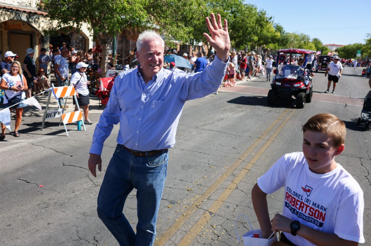 Mark Robertson, Republican primary candidate for Nevada's 1st Congressional District, waves during the 75th annual Damboree parade in Boulder City on Tuesday, July 4, 2023. (Jeff Scheid/The Nevada Independent)