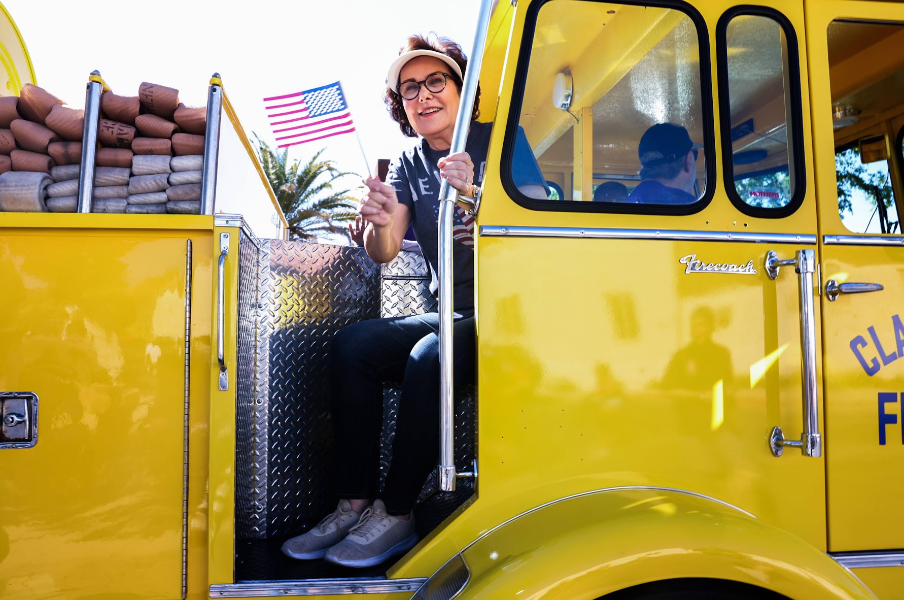 Sen. Jacky Rosen (D-NV) rides a fire truck during the 75th Annual Damboree parade in Boulder City on Tuesday, July 4 2023. (Jeff Scheid/The Nevada Independent).