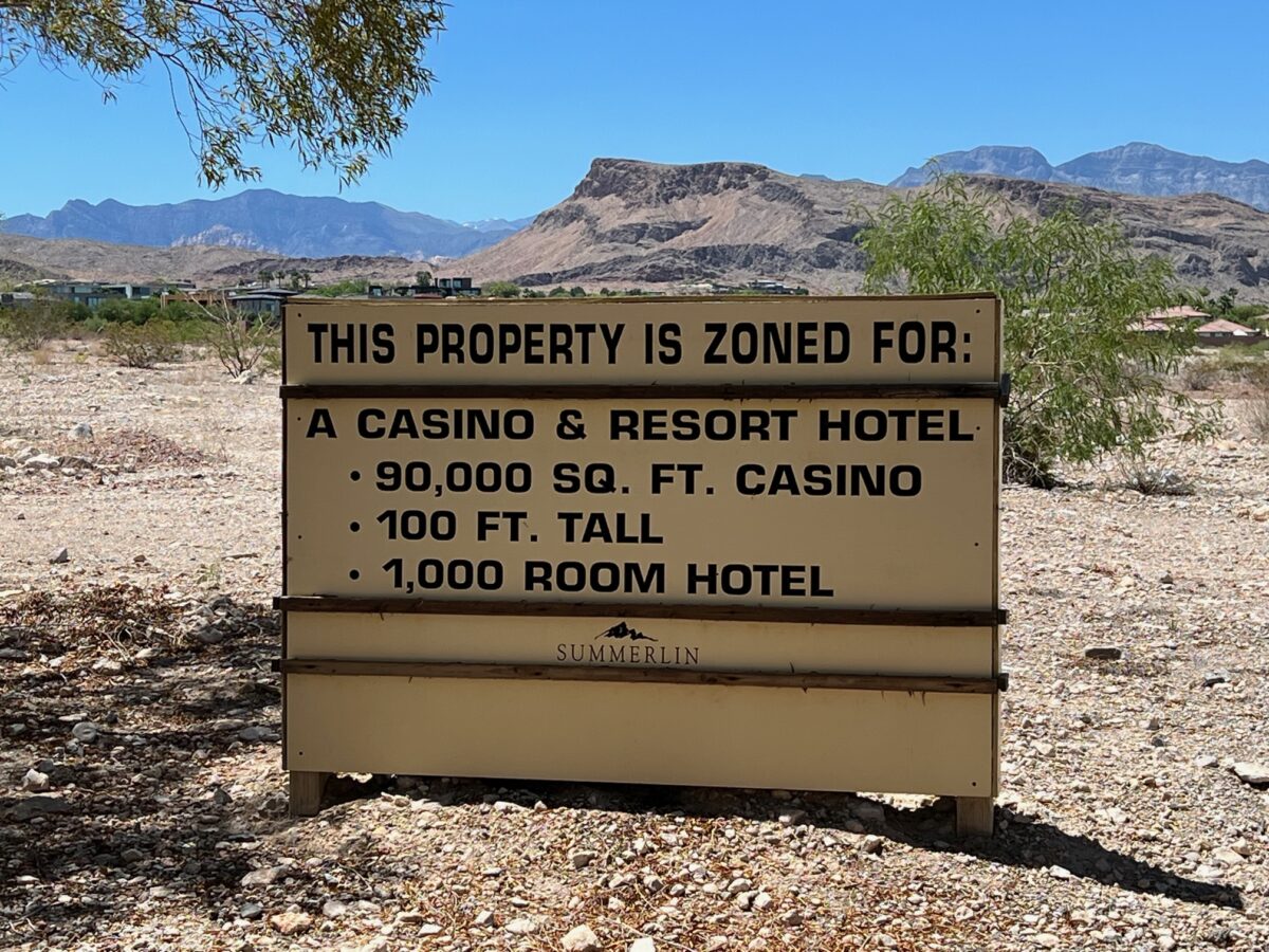 Signage on 58 acres owned by Red Rock Resorts at the intersection of Flamingo Road and Town Center Drive in Summerlin is designated as a site for a future hotel and casino and seen on Thursday, July 13, 2023. (Howard Stutz/The Nevada Independent)