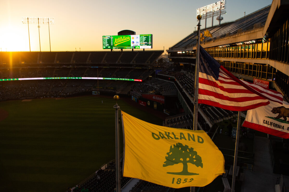 A's raise team flag above Oakland's city hall after Raiders' Las