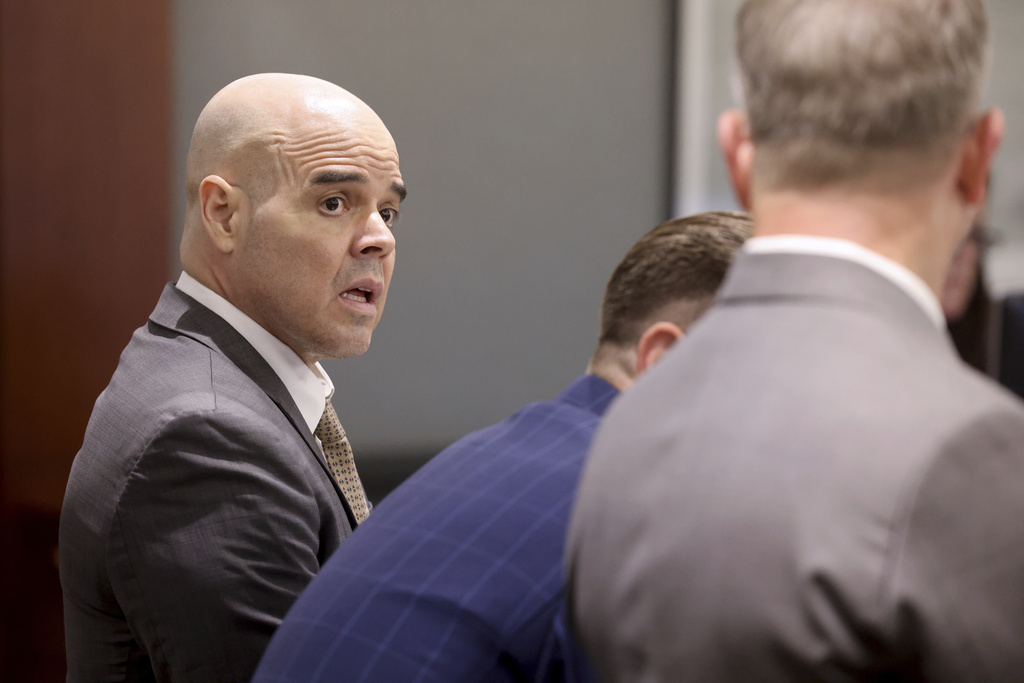 Robert Telles, left, talks with his attorneys Robert Draskovich, right, and Michael Horvath, in court prior to jury selection on the second day of his murder trial at the Regional Justice Center in Las Vegas