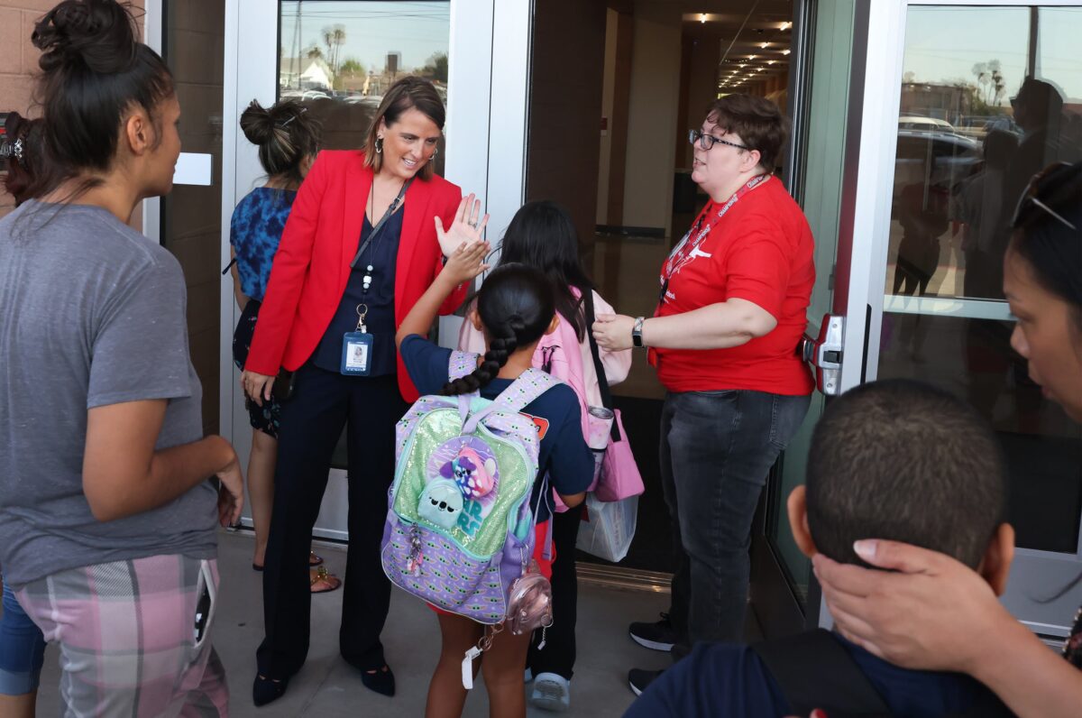 Staff greets students at the rebuilt Red Rock Elementary School on Aug. 12, 2024. (Jeff Scheid/The Nevada Independent)