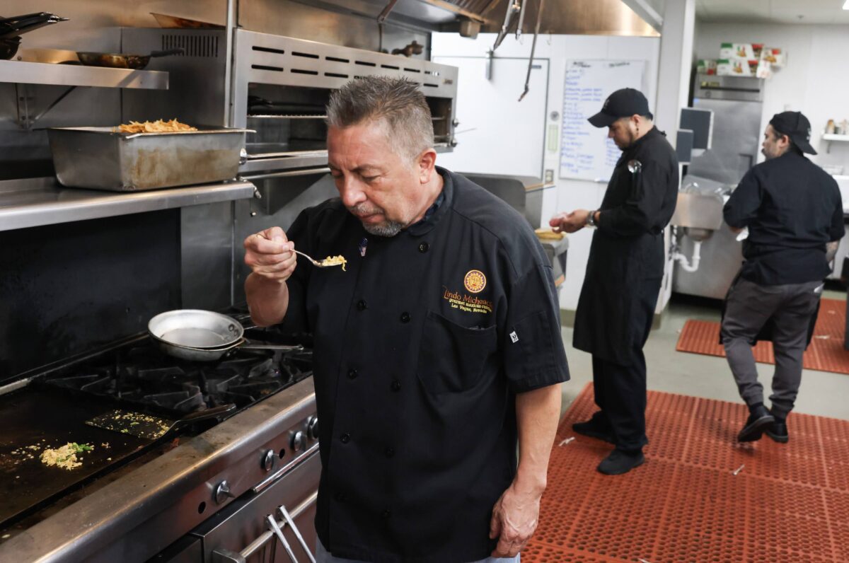 Javier Barajas, owner of ll Toro E La Capra restaurant in Las Vegas, samples food.