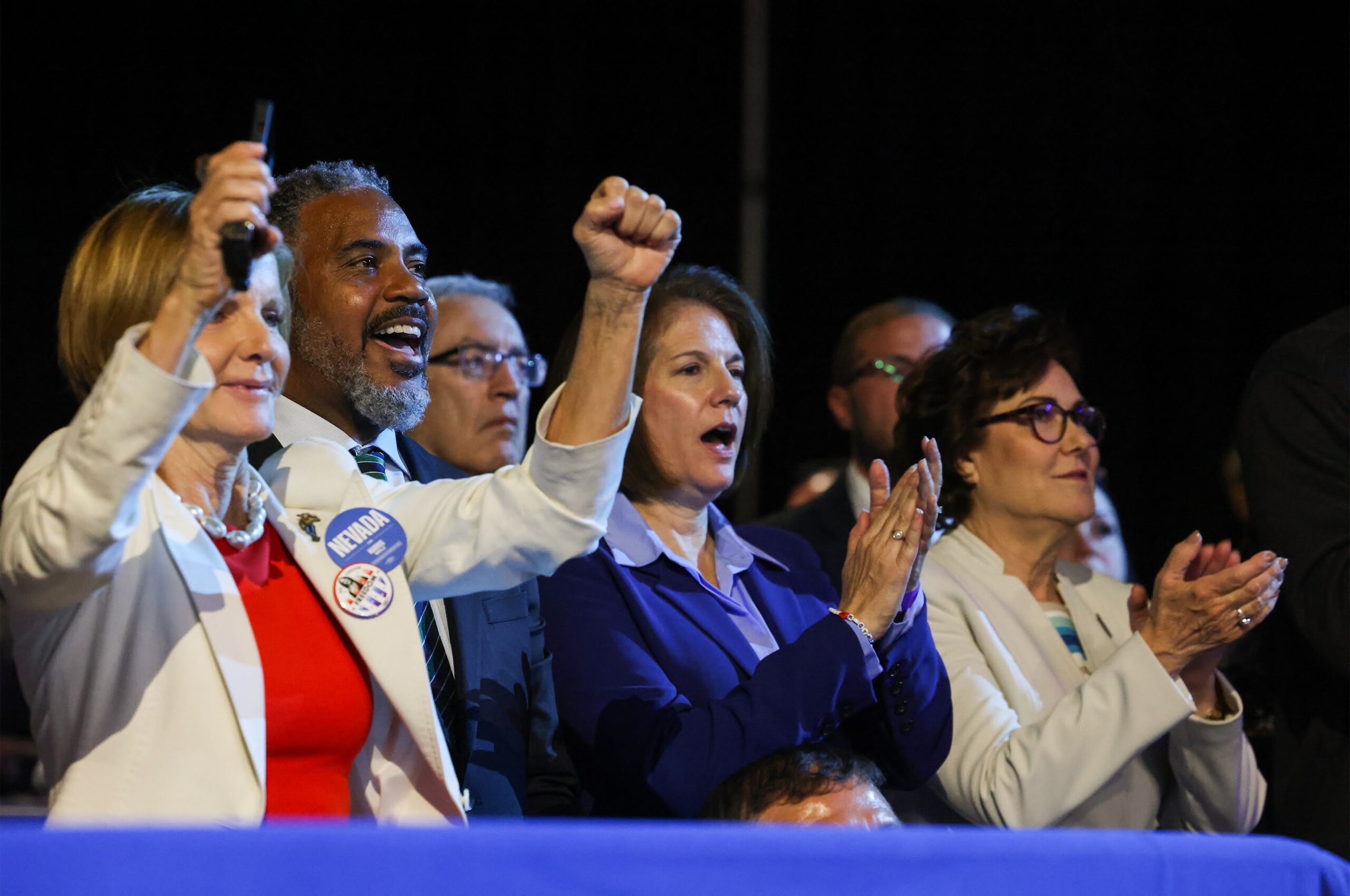 From left, Rep. Susie Lee (D-NV), Rep. Steven Horsford (D-NV), Sen. Catherine Cortez Masto (D-NV) and Sen. Jacky Rosen (D-NV) cheer while Vice President Kamala Harris speaks during a campaign rally at The Expo at World Market Center in Las Vegas on Sept. 29, 2024. (Jeff Scheid/The Nevada Independent)