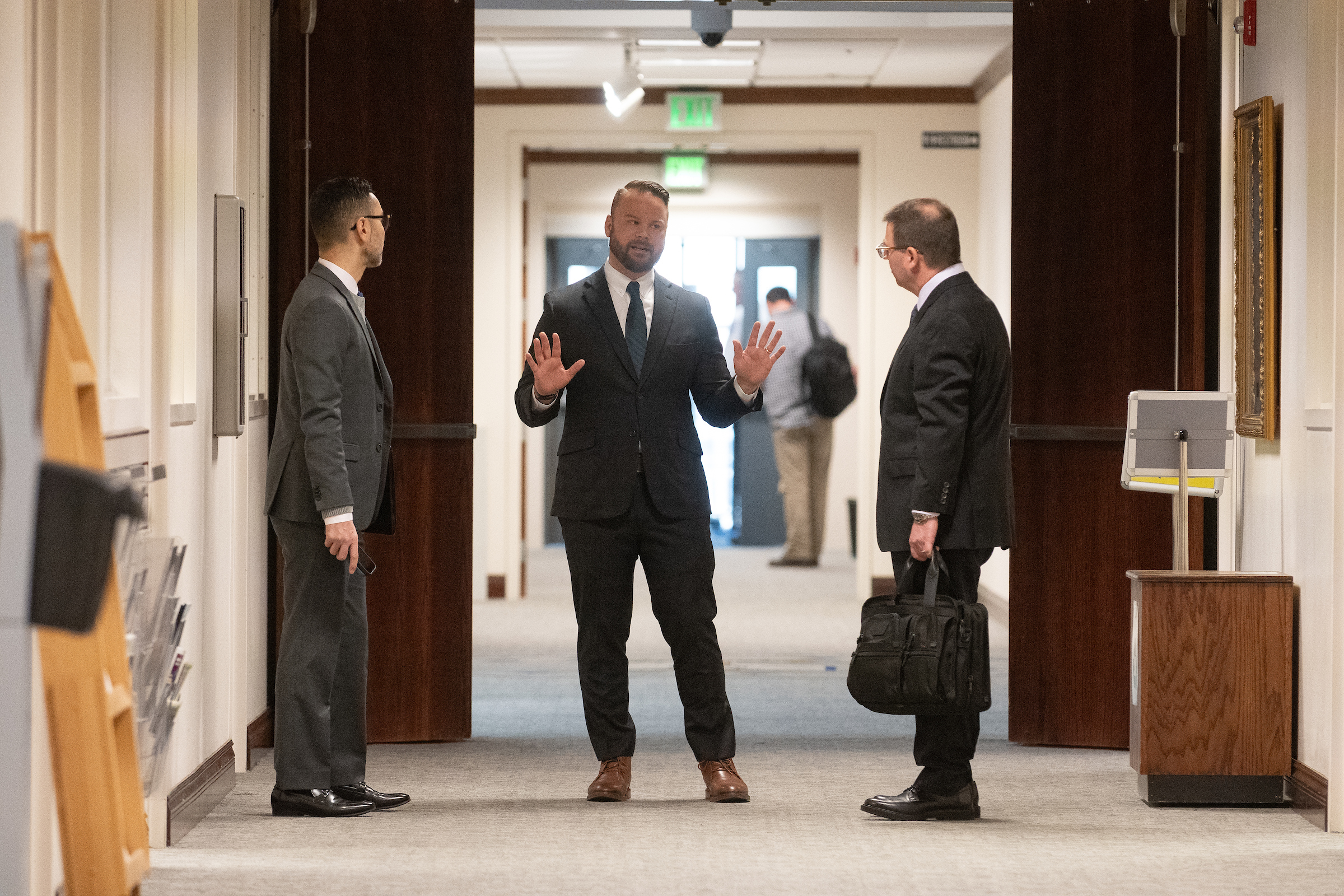 Lobbyist Matt Walker, center, with Sony Pictures Entertainment executives Nick Velasquez, left, and Michael Morgenthal, inside the Legislature in Carson City.