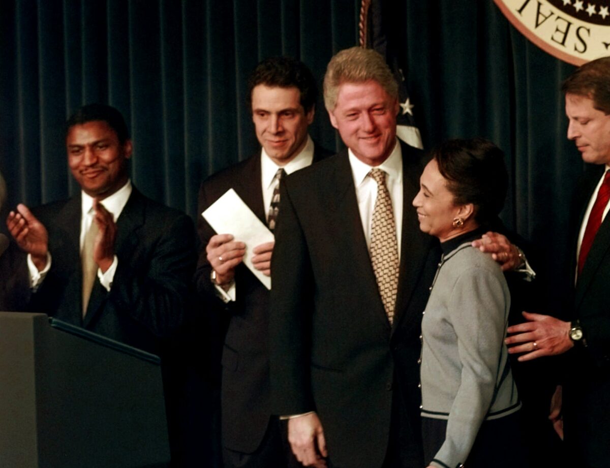 President Bill Clinton embraces Labor Secretary-designate Alexis Herman during a news conference in the Old Executive Office Building in Washington on Dec. 20, 1996.