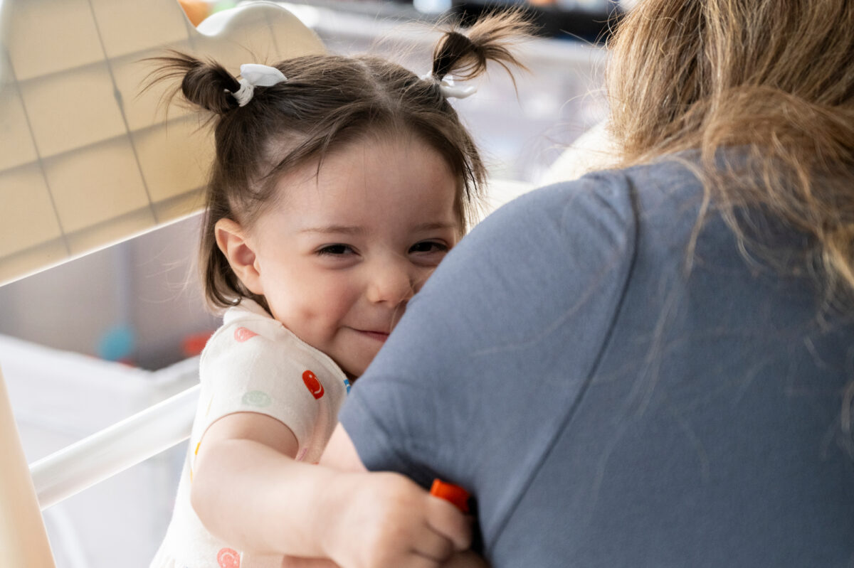 Patricia Orellana holds her daughter Grace inside their Las Vegas home.
