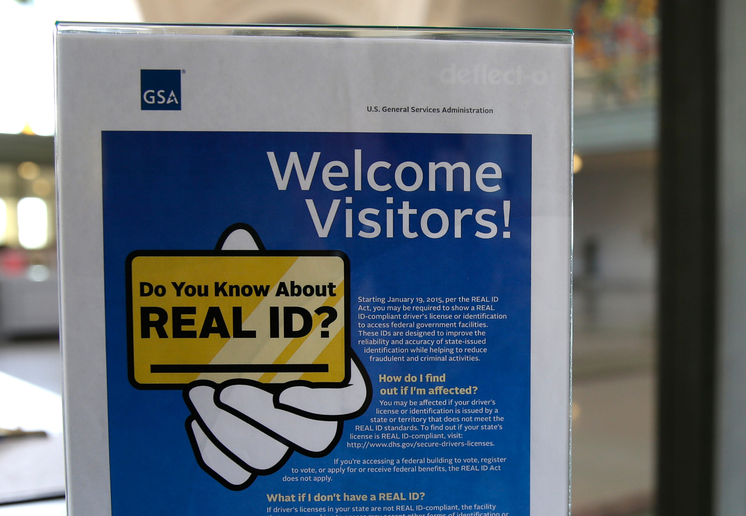 In this photo taken April 6, 2016, a sign at the federal courthouse in Tacoma, Wash., is shown to inform visitors of the federal government's REAL ID act.