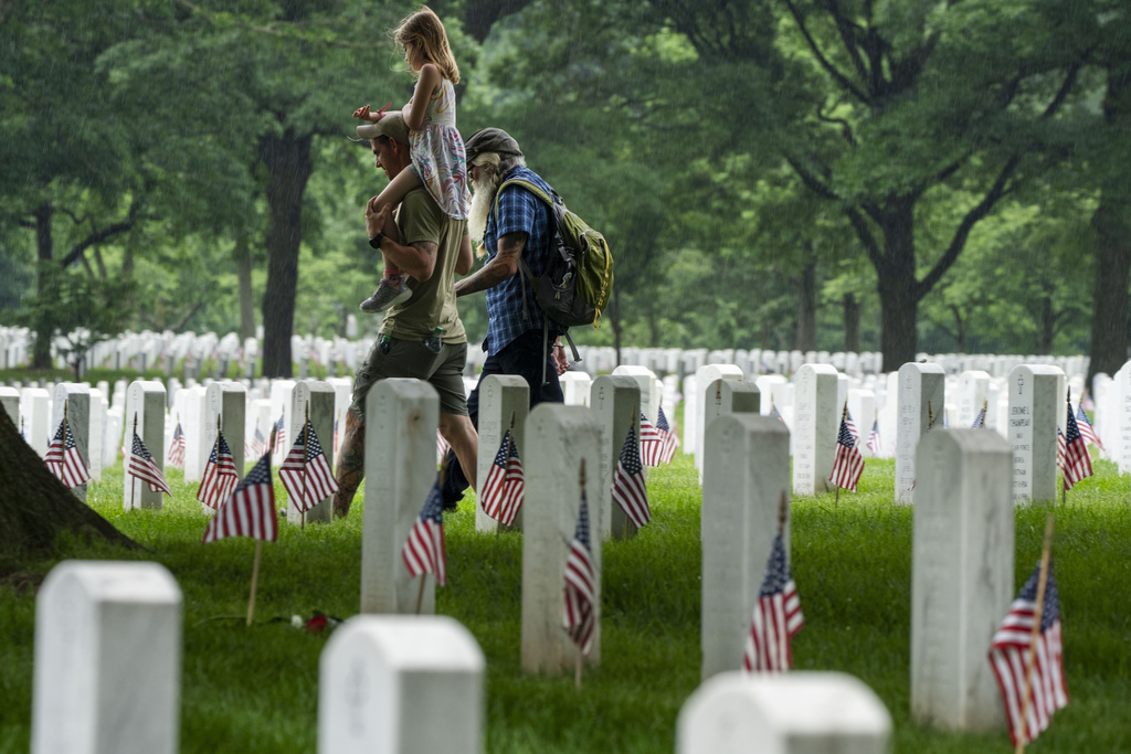 Families visit Section 60 of Arlington National Cemetery, in Arlington, Virginia.
