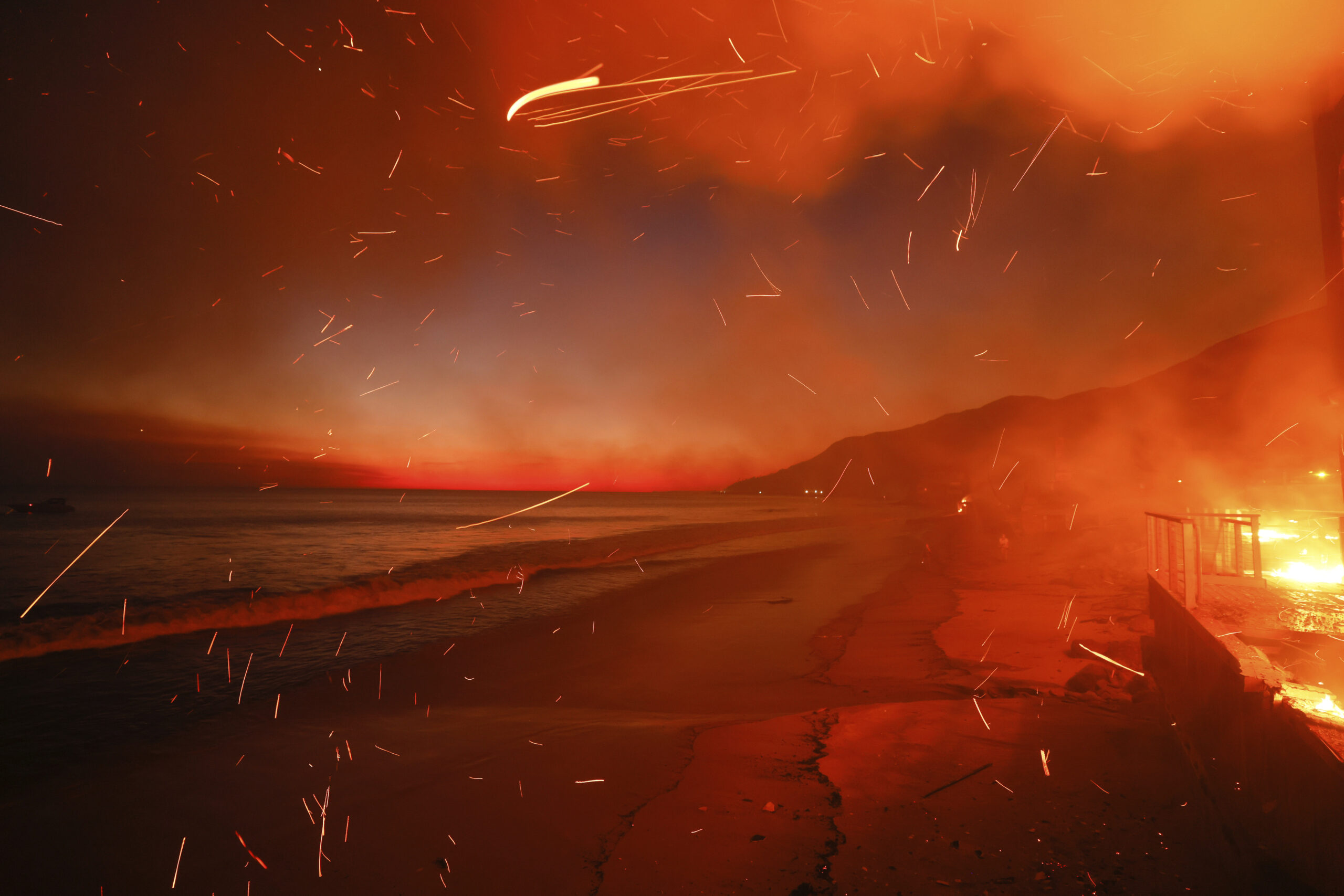 The Palisades Fire burns a beach front property on Jan. 8, 2025, in Malibu, California.
