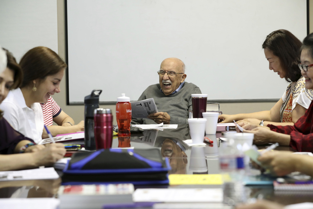 Instructor Vito Susca shares a laugh with his English as a Second Language class at the Fort Bend Literacy Council in Sugar Land, Texas.