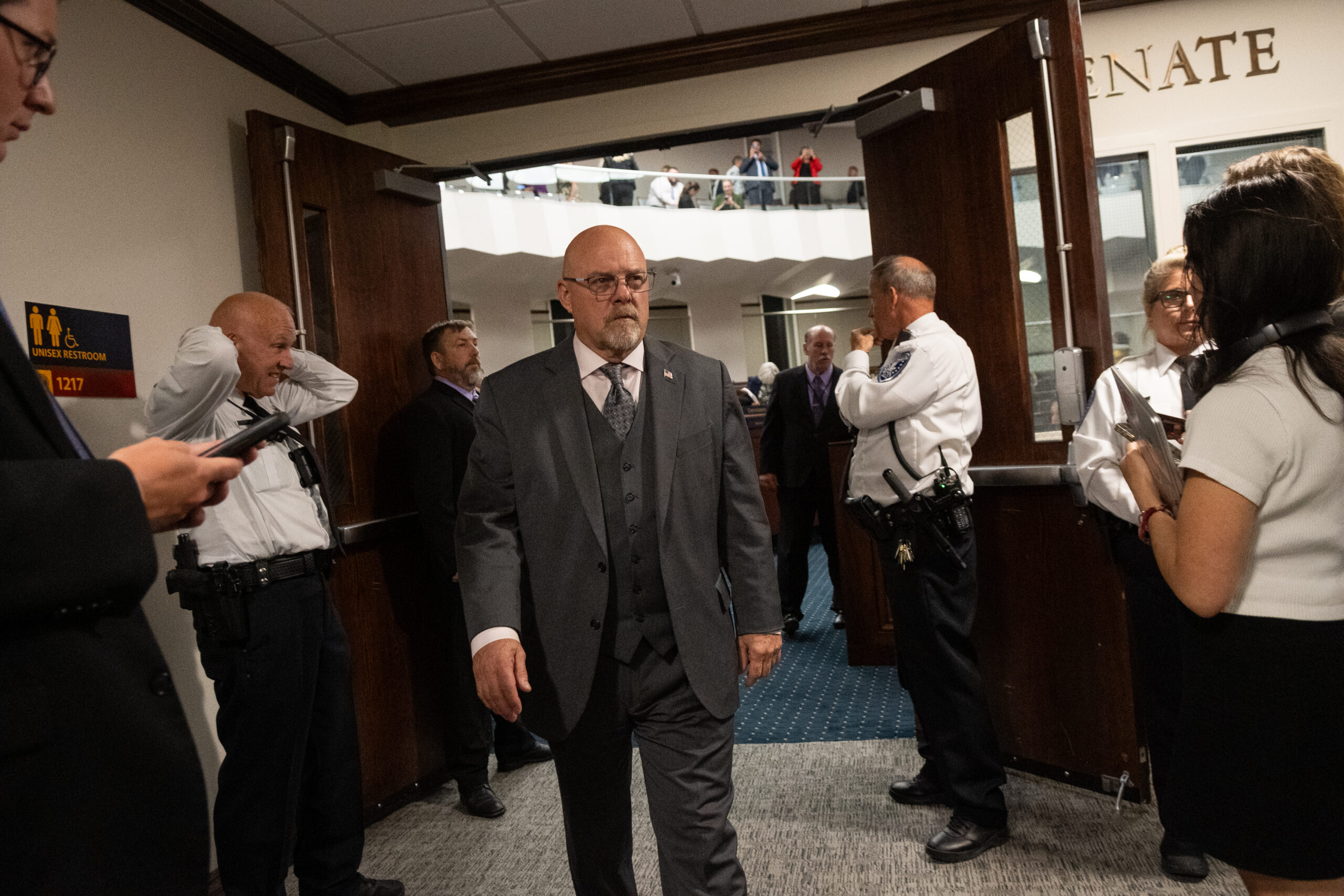 Sen. Ira Hansen (R-Sparks) leave the Senate chamber.