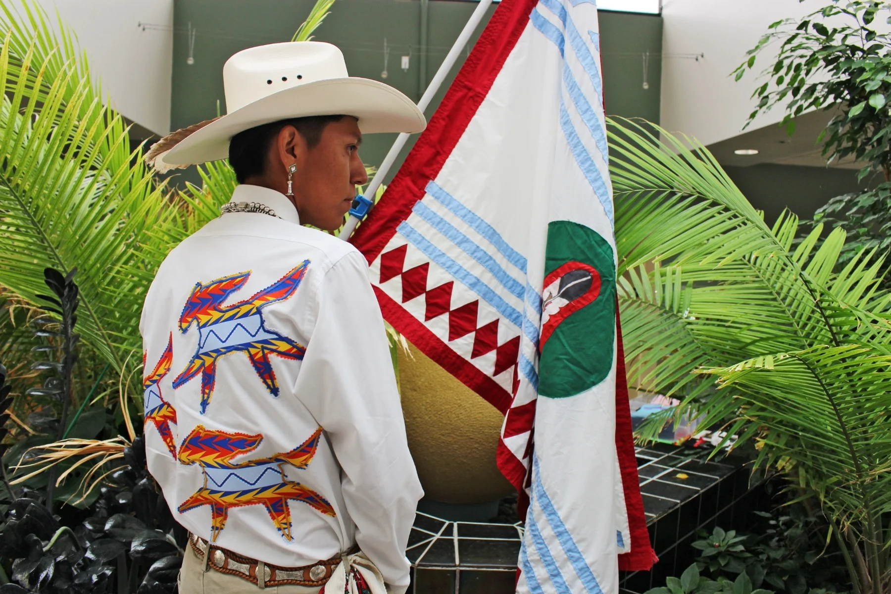 Justin Couchum, a member of the Te-Moak Tribe of Western Shoshone, wears a shirt he created for the Two Spirit Conference’s fashion show event.