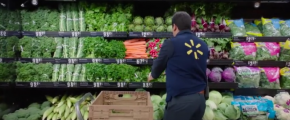 Walmart worker stocking produce (via IBM Blockchain Platform video)