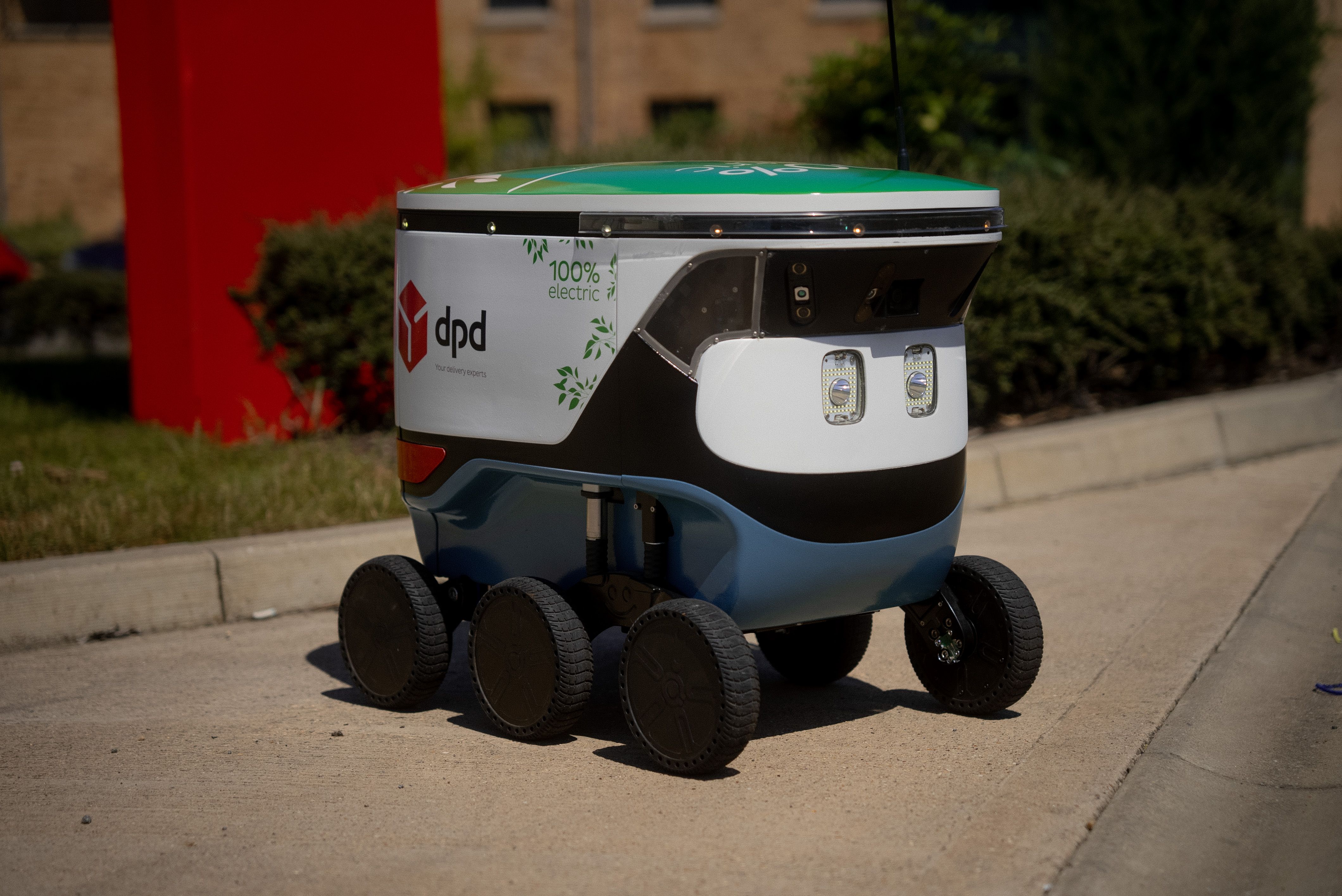 robot geopost on sidewalk