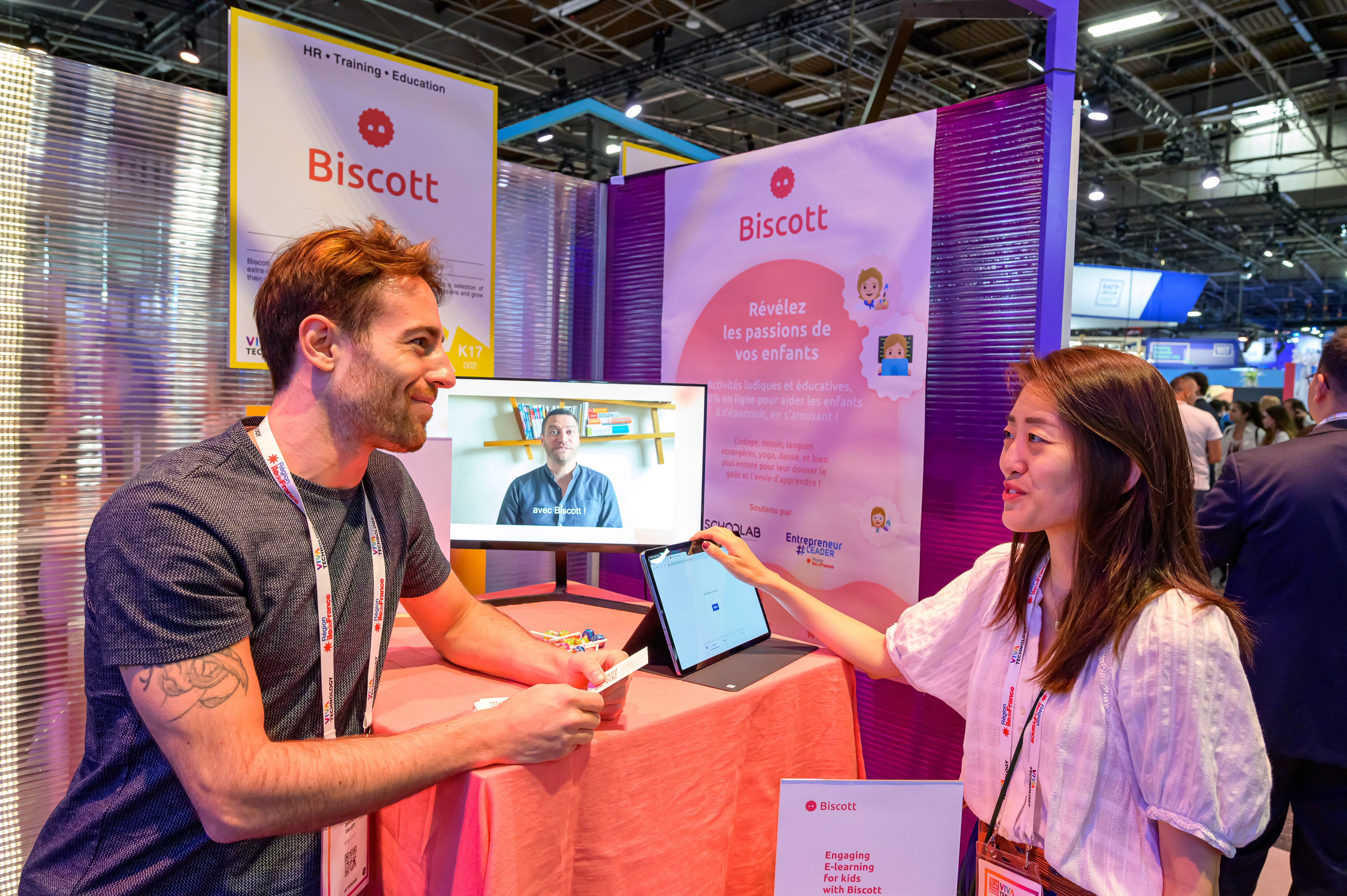 two people networking in front of startup booth