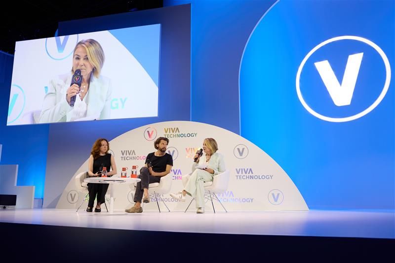 Justin McLeod and Esther Perel on stage with a moderator
