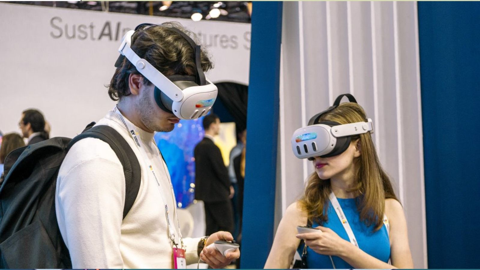 One man and one woman trying on a VR headset