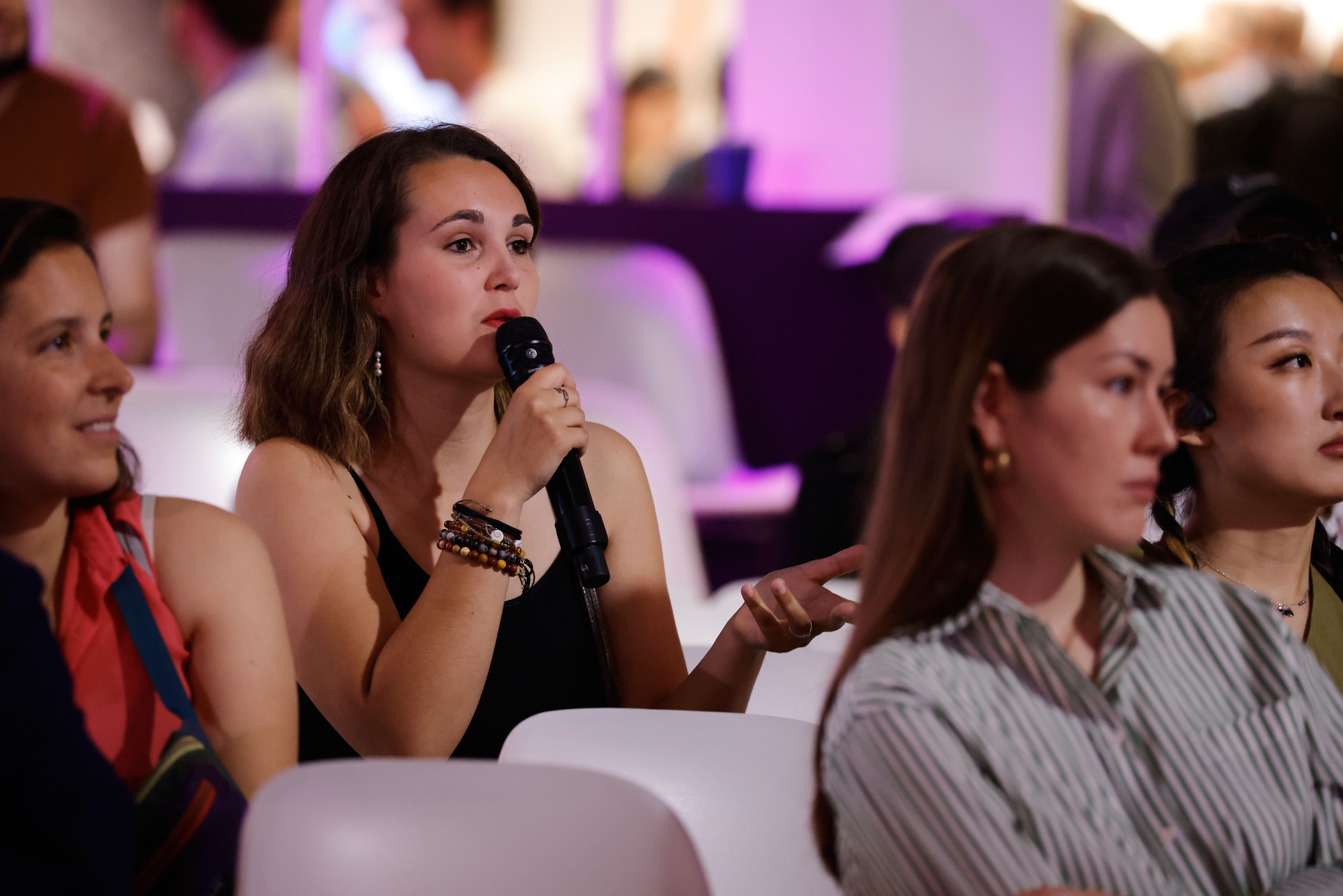 an attendee asking a question in the crowd of a VivaTech session