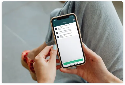 Mobile phone in person's hand