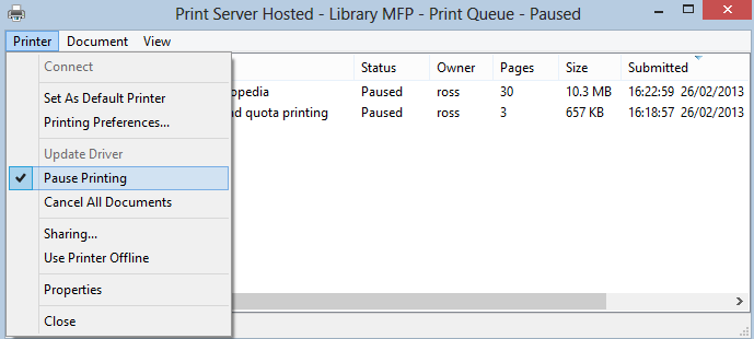 Go to ‘Printer’ and then ‘Pause Printing’ to pause the print queue