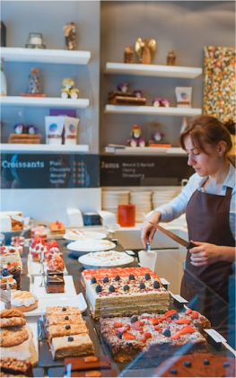 Bakery worker preparing food to sell