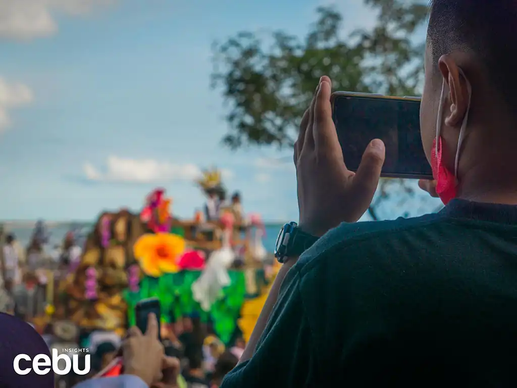 Audience member filming the Sinulog 2023 Grand Parade