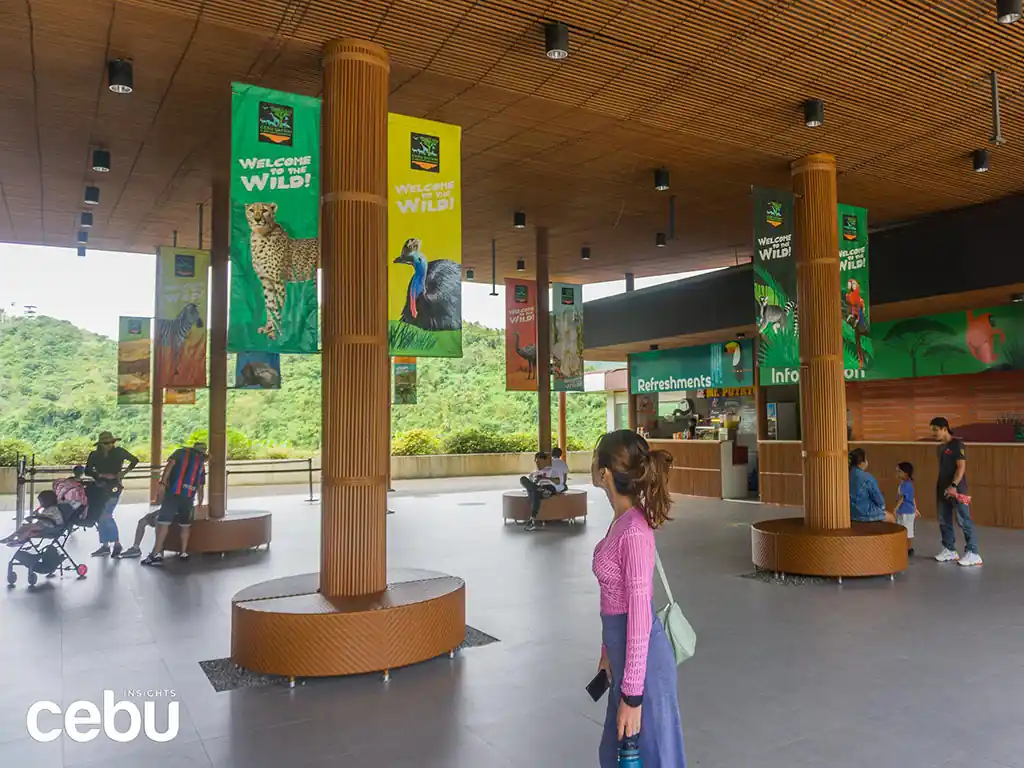 Woman walking around the lobby of the Cebu Safari Adventure Park