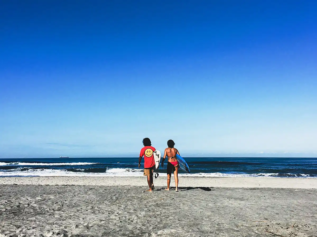 Two surfers at one of the surf spots in the Philippines