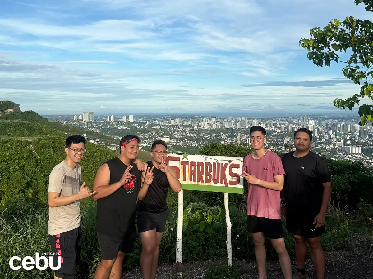 OK– Starbuks_4 Hikers posing at the Starbucks Banawa signage