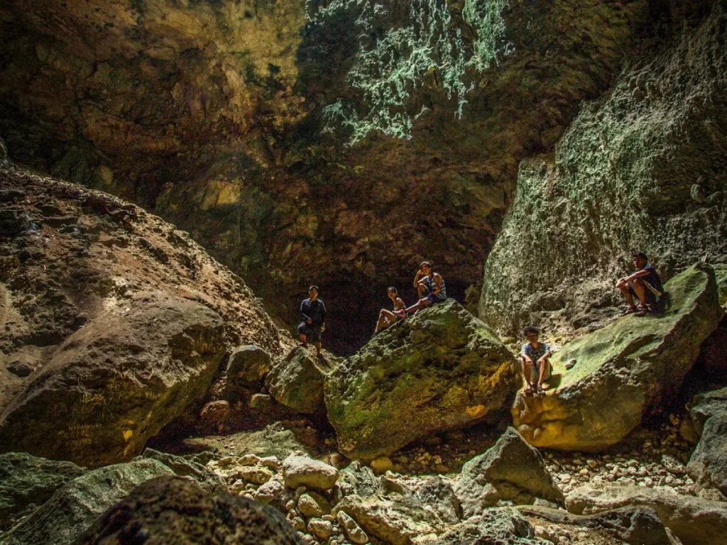 Hikers posing at the rock formations of the Balay sa Agta in Argao