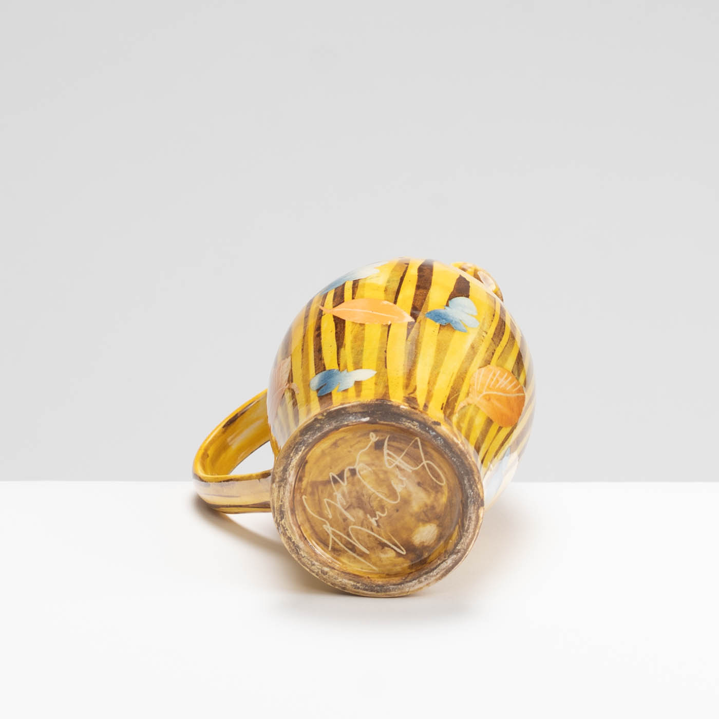 SM242Y1029 Small Curved Jug - Yellow stripes, leaves and butterflies