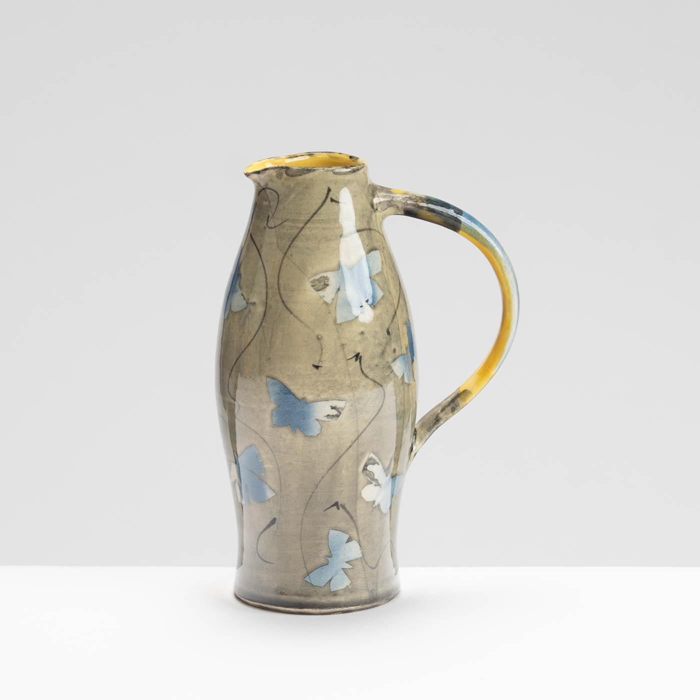 SM242Y1032 Small Curved Jug - Blue butterflies on grey