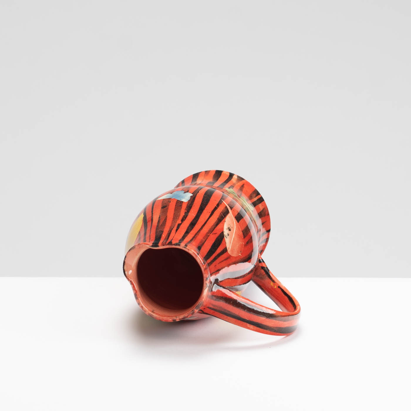 SM242Y1028 Small Curved Jug - Red stripes, leaves and butterflies