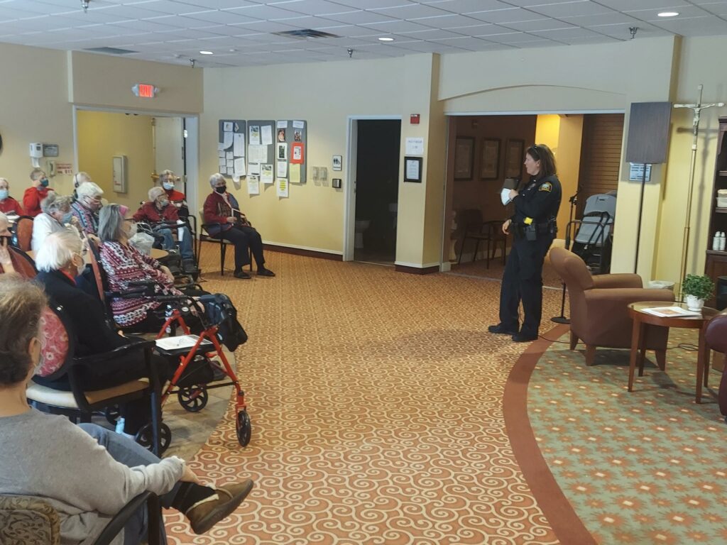 police officer speaking with residents