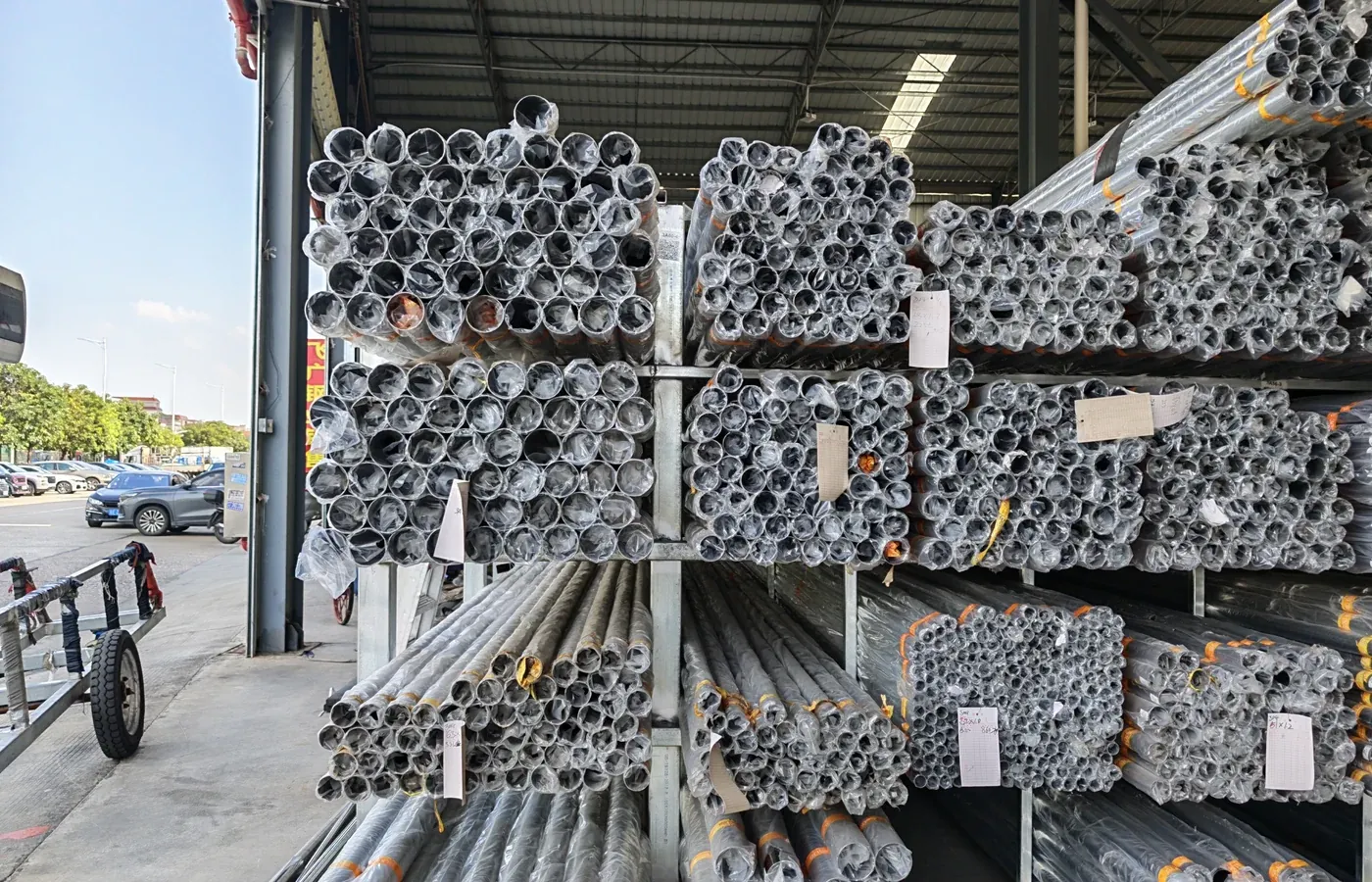 Strapped, packed stainless steel pipe bundles ready for export distribution