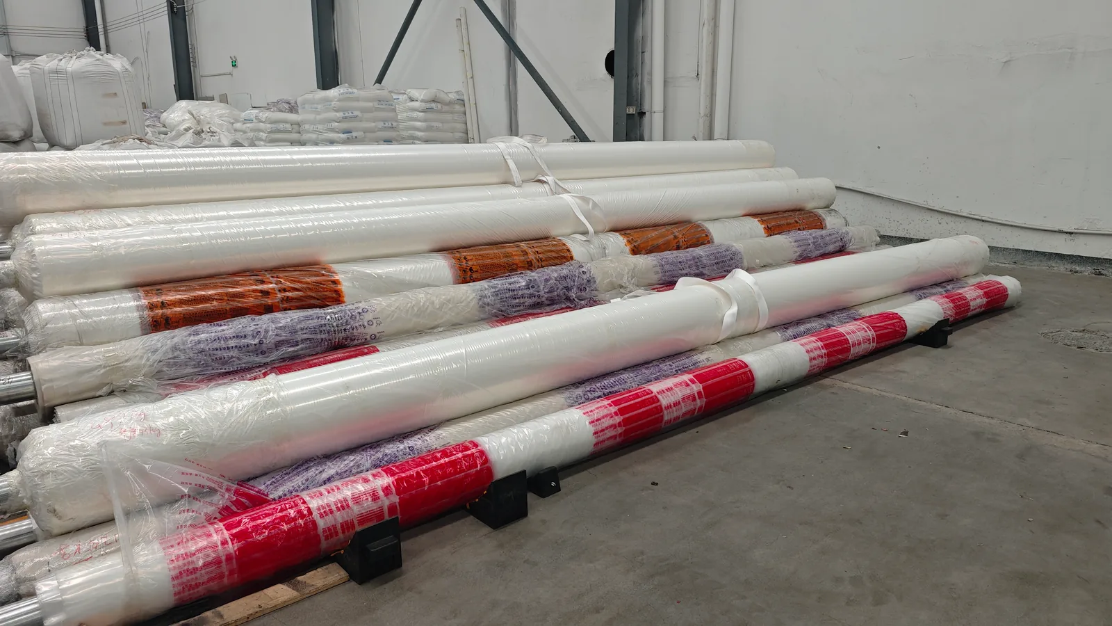 Clear and printed film rolls showing different packaging formats in the workshop