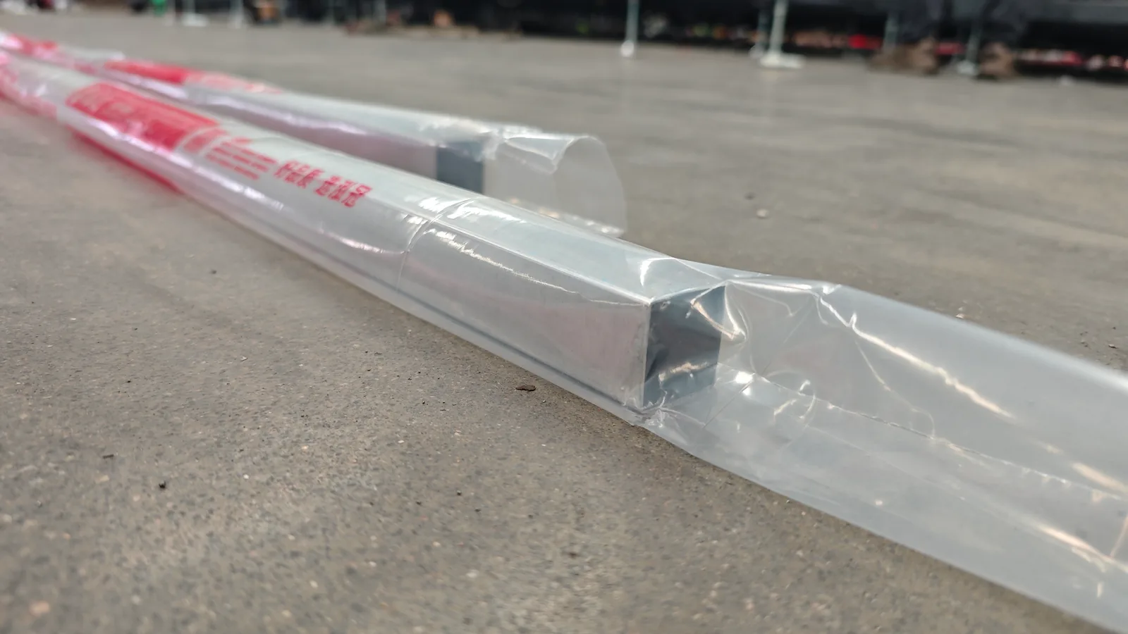 Rectangular metal profiles individually covered with clear and printed film
