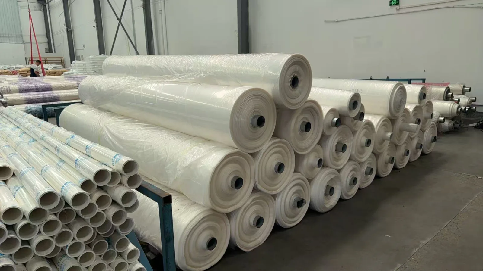 Packaging film rolls stacked in the workshop with their wound layers and cores visible