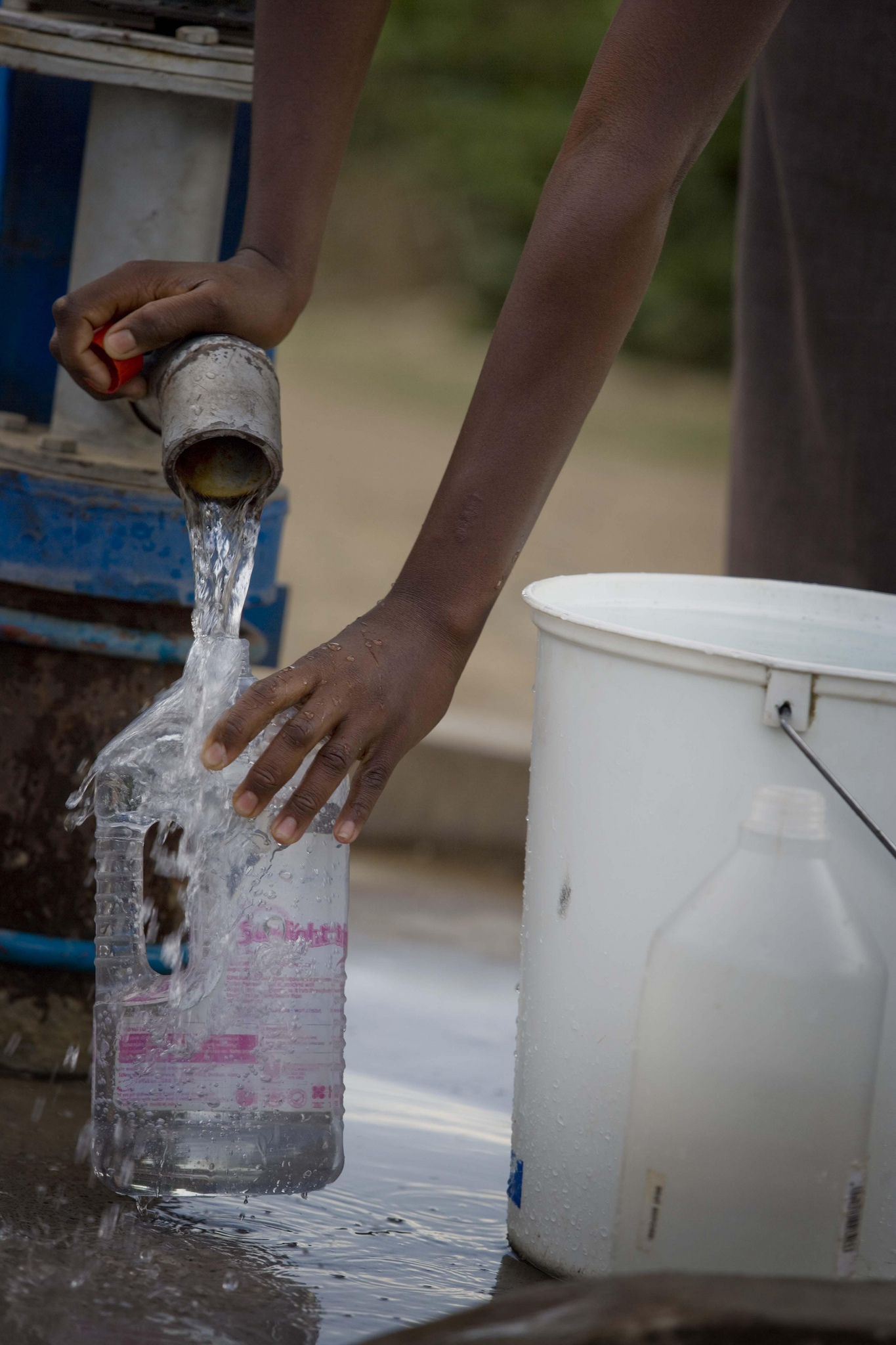 A girl collects clean water from one of 22 boreholes in the Budiriro District of Harare, Zimbabwe made possible with funding from Australia in partnership with UNICEF. The district was badly affected by cholera in 2009. Photo: Kate Holt/Africa Practice