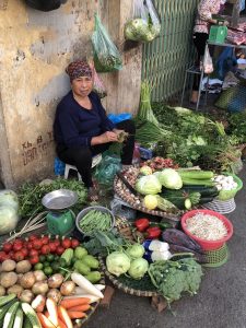 Vendor in wet market in Hanoi