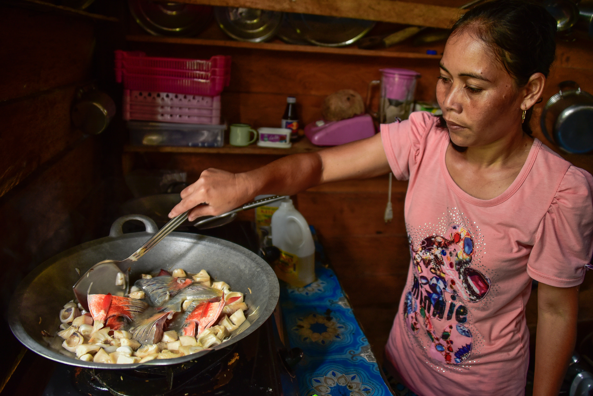 Indonesian woman cooks food : Changing diets in Kapuas palm oil