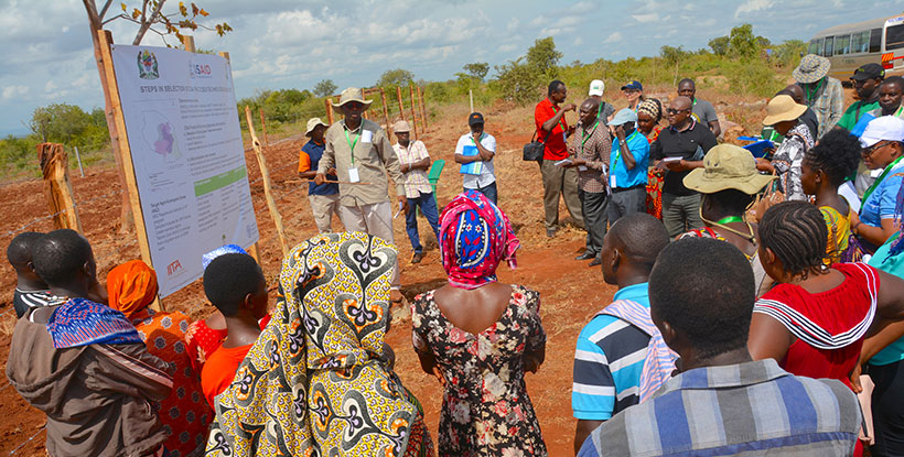 Dr Fidelis Myaka, Project Manager for the Building capacity for Resilient Food Security project explaining the CSA practices selected and being demonstrated at the demonstration plot at Kilimbili village, Morogoro.