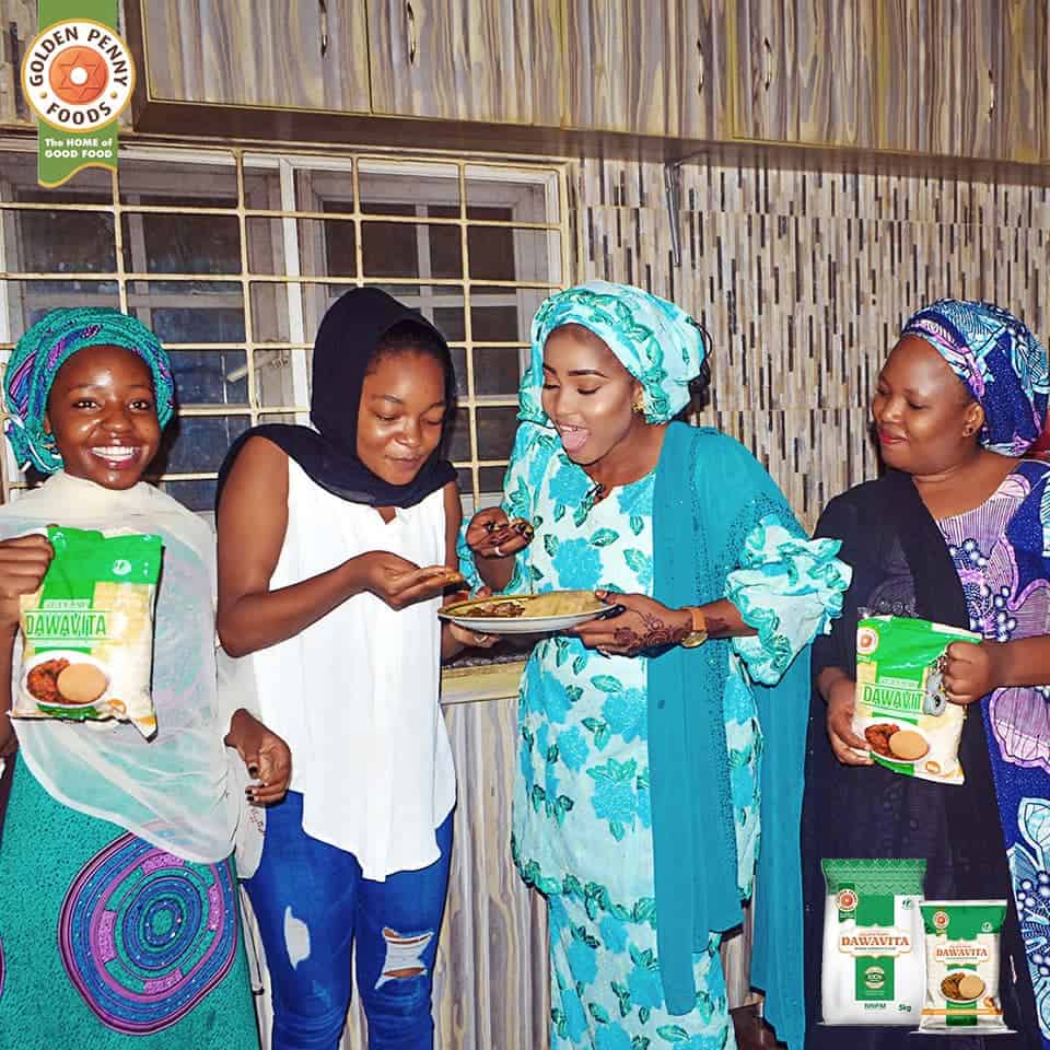 A group of women enjoying dishes made with Dawavita flour.