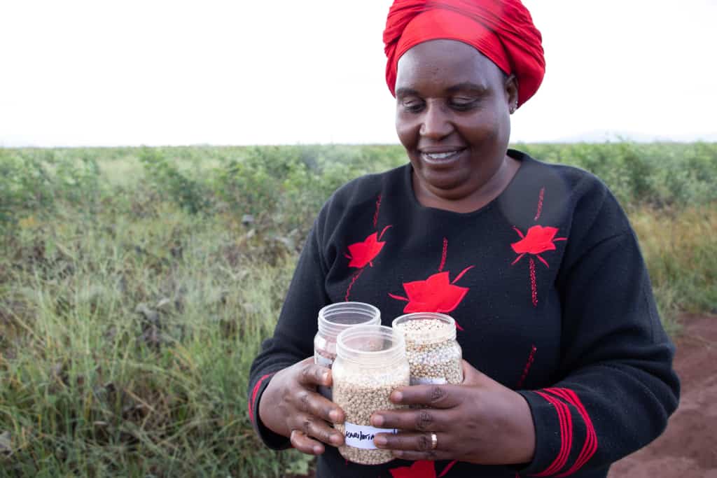 Farmer Betty shows her certified seed for her farm in Emali, Makueni County. Photo: AVCD