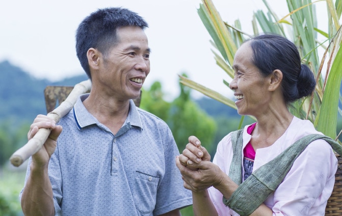 Bui Van Ben (left) and Dinh Thi Hong (right), Muong ethnic people in Vietnam grow rice and keep pigs, buffalos, chickens in their house to generate more incomes. Photo: ILRI/Vu Ngoc Dung.