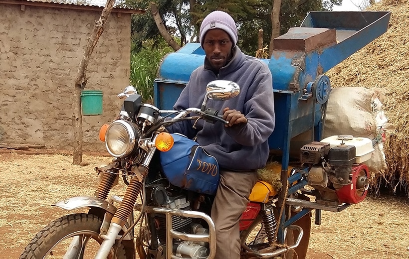 A youth provides services to farmers in a rural setting (Photo: C. Mutungi/IITA).