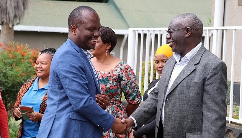 Permanent Secretary, Gerald Kusaya shaking hands with IITA Chief Scientist, Prof. Mateete Bekunda. Photo credit: Eveline Massam/IITA