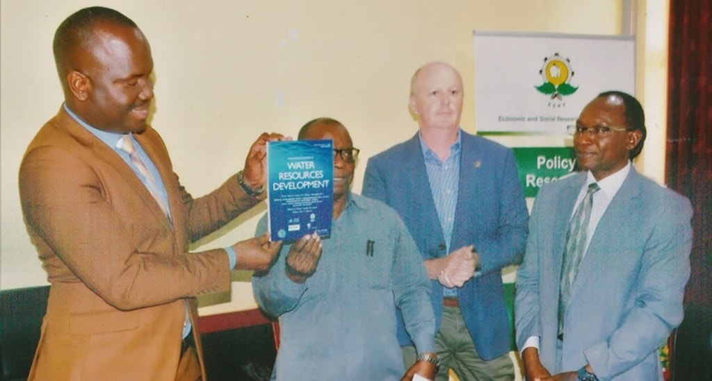 (L to R) Mr Gerald M Kusaya, Permanent Secretary of The Ministry of Agriculture, Tanzania, releasing the special journal issue during a National Policy Dialogue held in Dodoma, December 2020. Also in the photo Mr Abel Songole (ESRF), Dr Anthony Whitbread ICRISAT and Dr Makarius Mdemu, Ardhi University. Photo: Ardhi University